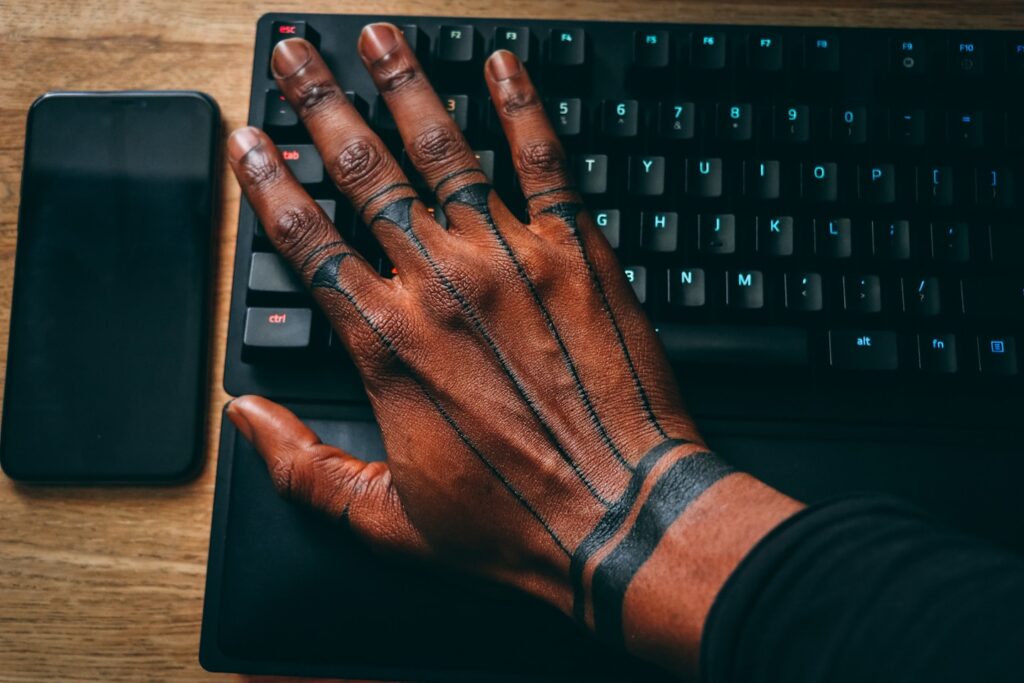 man with hand tattoo